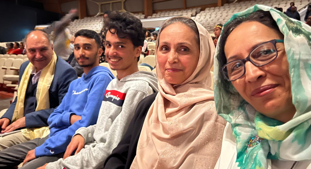 Dr Arif Saeid, and Hakim, Kamal, and Farida Sakhawarz, and Fahima Saied photographed in the audience at an event in Auckland
