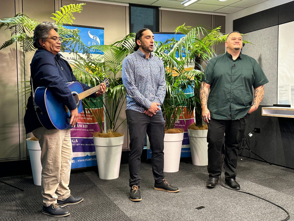 Keelan Ransfield, Team Leader, Noel Rawiri Woods, Inspirational Speaker, and Brent Mio, MC, on camera at Kahukura Workshop 2023