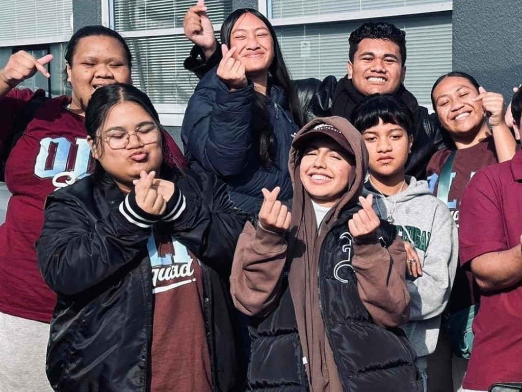 Cross-cultural friendship in action: Ihapera Waru-Martin (front left) and Waila Michan Khel (centre) with the Ōtara Coding Team in Manukau when they sharpened their coding skills by working via Zoom with students in Korea to build a live website.