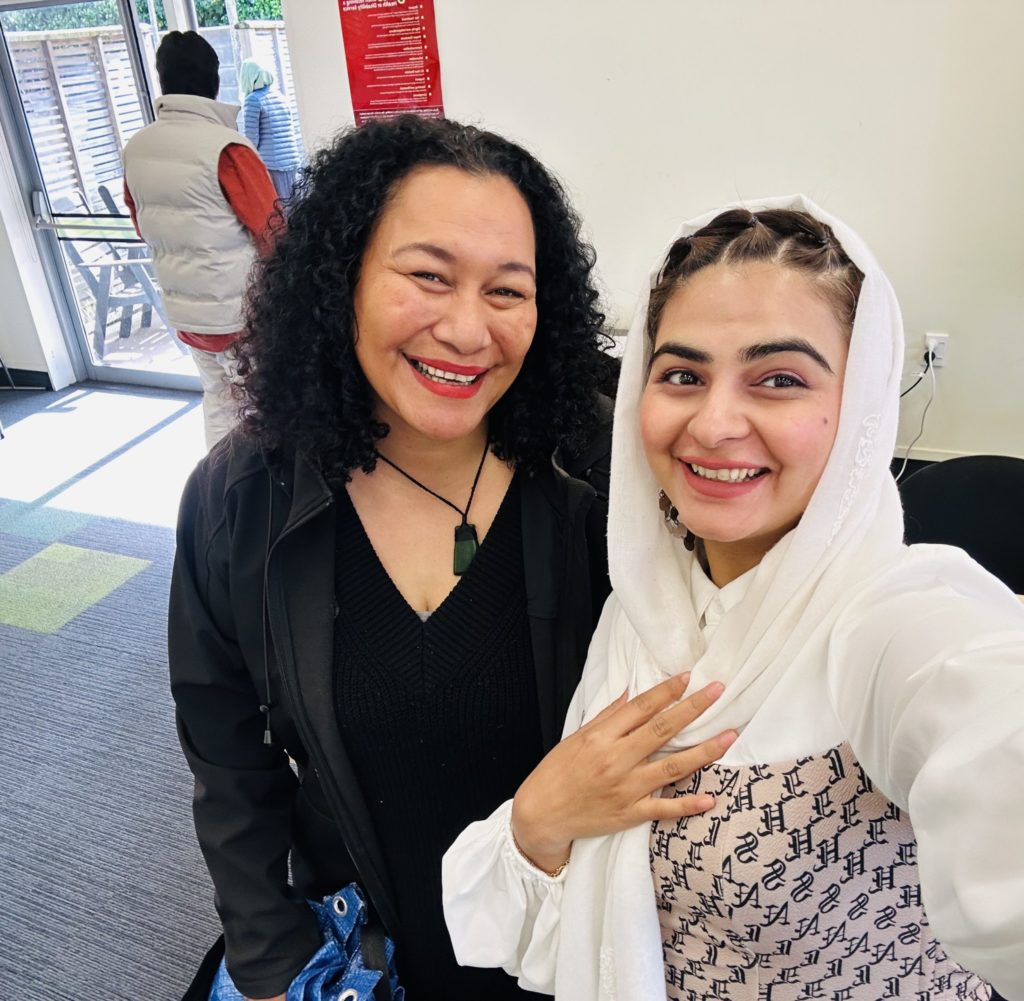 Paddy Hawke from Orakei Marae and Behishta Najibi, a Youth and Family Support worker with the New Settler Family and Community Trust, smile for a photo at Te Tahawai Marae in Pakuranga.