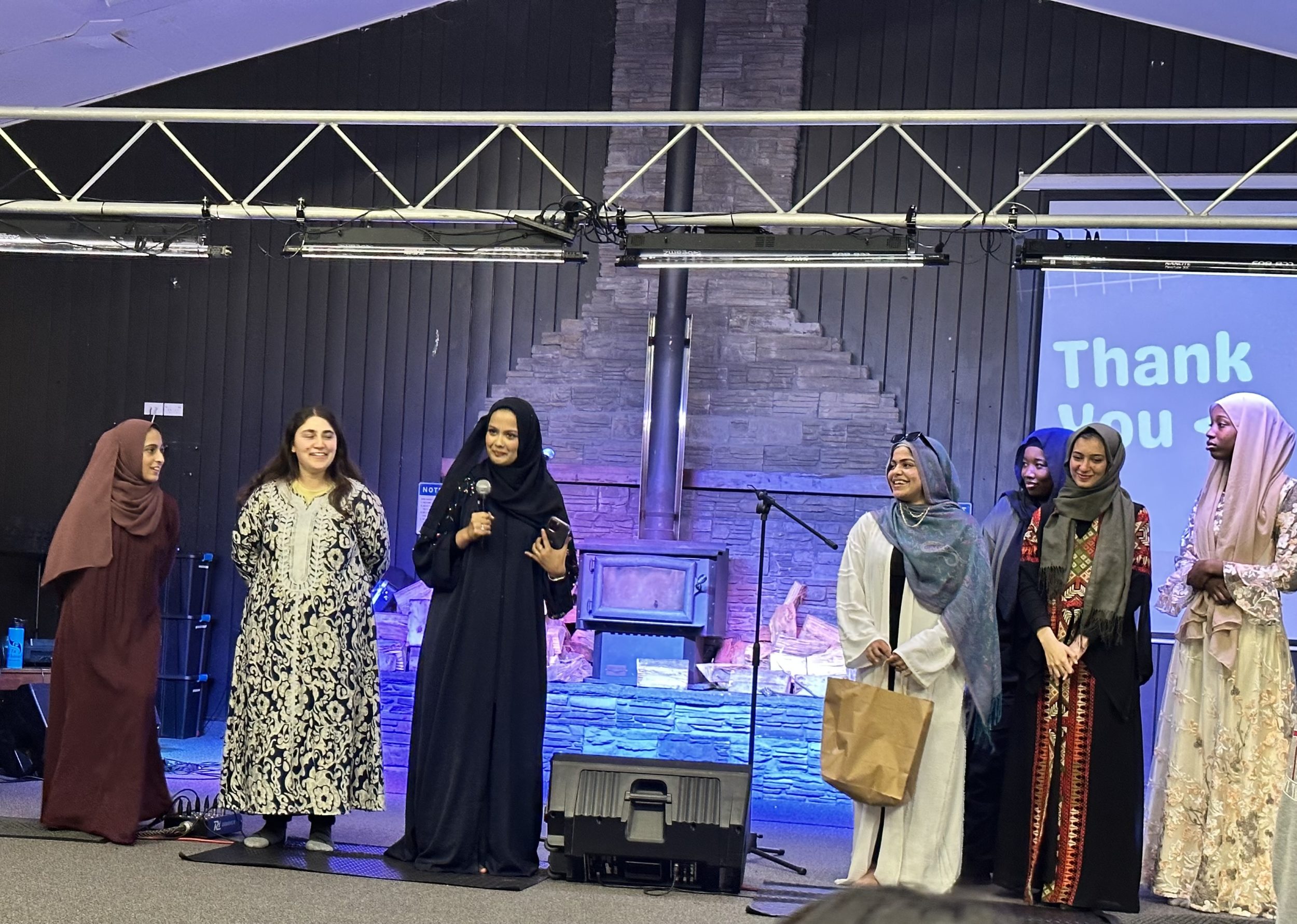 Rangatahi from various refugee and migrant communities on stage during the cultural event