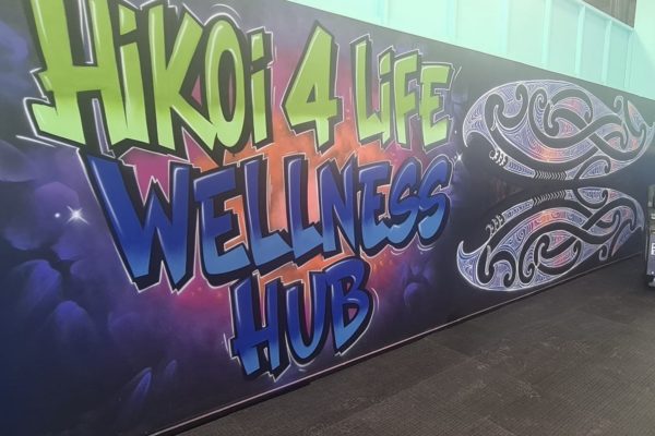 Image of a mural done in graffiti saying "Hikoi4Liife Wellness Hub"