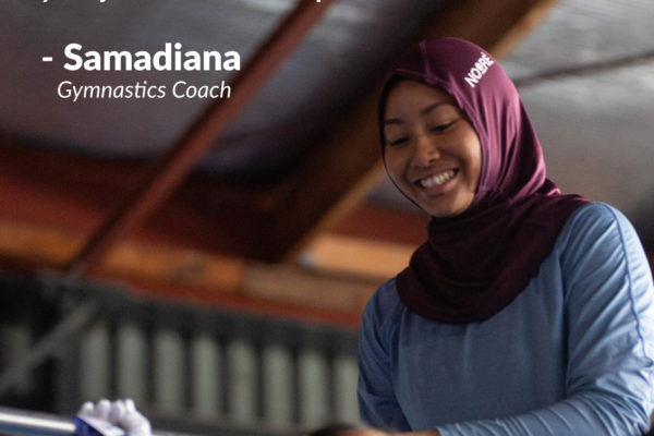 This image is one of the CHILL social media posts. White writing on a grey background at the top of the image says: "By being open to what people say the things you learn, and not just being in your own view, you can overcome certain biases within yourself, and then overall, you'll just become a better person." Samadiana, Gymnastics Coach. Below that, a woman wearing a maroon hijab and a blue shirt stands next to a silver bar on which a young child, who is out of focus, is swinging. The child is wearing athletic gloves on her hands. The woman is looking at and smiling at the child. At the bottom of the image are the words CHILL (Challenge Islamophobic Language & Loathing) and also IWCNZ (Islamic Women's Council New Zealand).