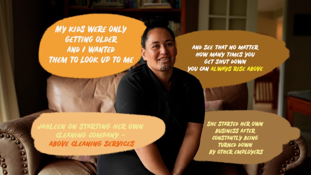 In this Mana Wāhine Hauora picture, a woman is seen front-on sitting in a lounge. She has a moko kauae. Four speech bubbles contain text around her. The bubbles top left and right say, "My kids were only getting older and I wanted them to look up to me and to see that no matter how many times you get shut down you can always rise above." The bottom text bubbles say," Jahleen on starting her own cleaning company - Above Cleaning Services. She started her own business after constantly being turned down by other employers."