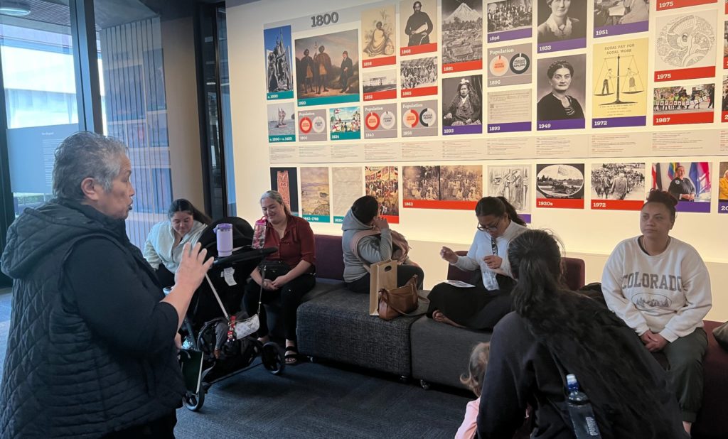 A tutor runs a hui for a group of wāhine from the Pōmare community