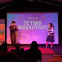 Tamati Moriarty and Paige Wilson from Hurō Productions on stage presenting as MCs for Ka Rere te Manu Awards 2026.