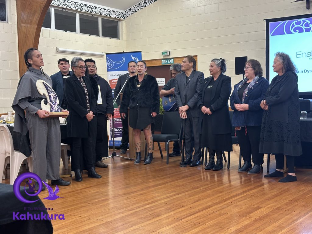 A group of Enabled Wairoa kaimahi stand in a semi-circle at the E ū Whānau Kahukura Awards 2026.