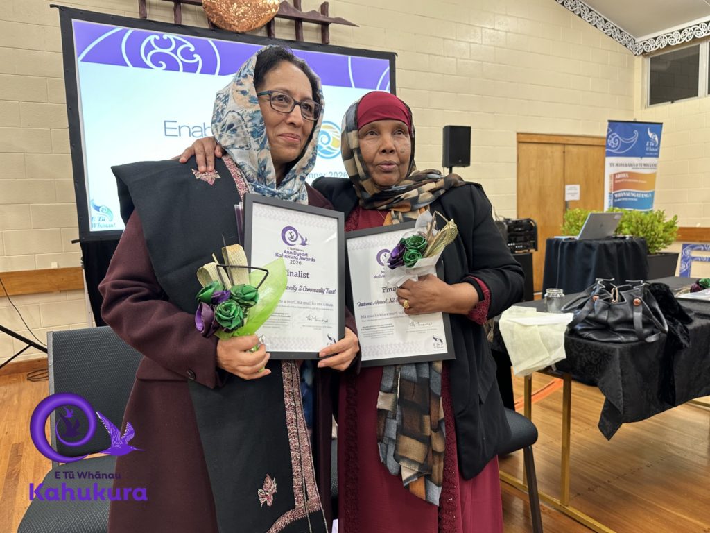 Fadumo Ahmed is pictured with another woman, Fahima Saied, at the Kahukura Awards ceremony. Both women hold certificates.